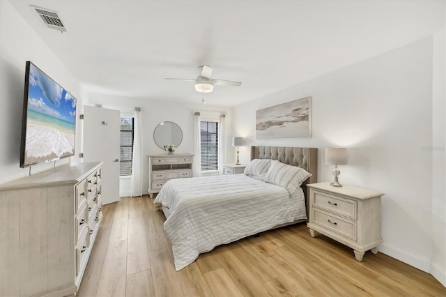23465 Harborview Rd Unit 1031, Punta Gorda, FL 33980 - bedroom with light wood-style floors and ceiling fan