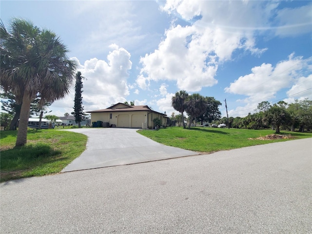 3456 Highlands Rd, Punta Gorda, FL 33983 - single story home with an attached garage, concrete driveway, and a front lawn