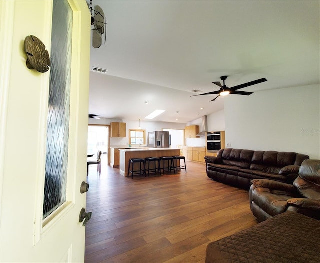 3456 Highlands Rd, Punta Gorda, FL 33983 - living area featuring hardwood / wood-style flooring, a ceiling fan, and lofted ceiling