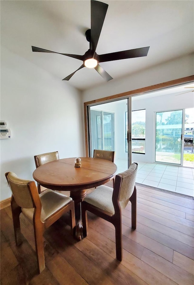 3456 Highlands Rd, Punta Gorda, FL 33983 - dining space featuring ceiling fan and wood-type flooring