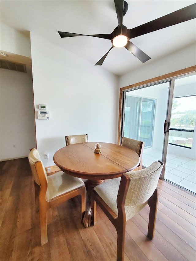 3456 Highlands Rd, Punta Gorda, FL 33983 - dining area with wood-type flooring and a ceiling fan