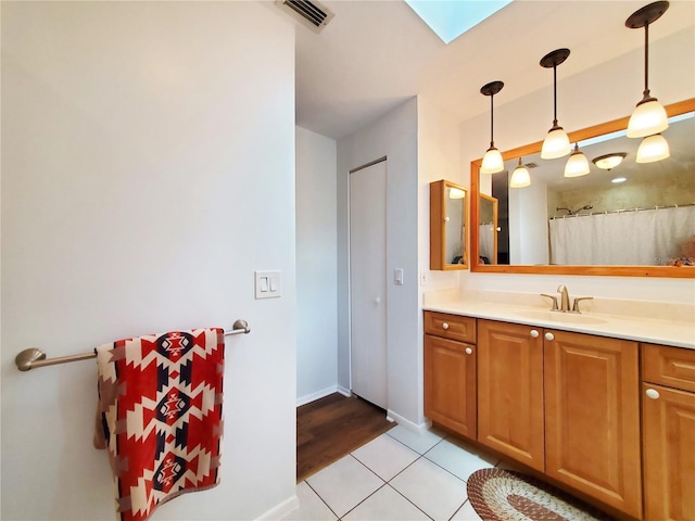 3456 Highlands Rd, Punta Gorda, FL 33983 - full bath featuring a skylight, vanity, and tile patterned floors
