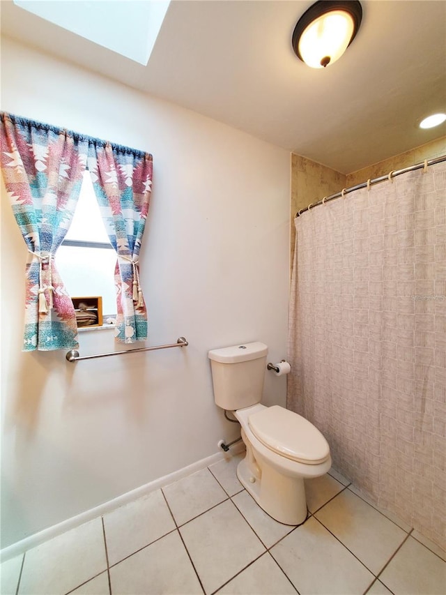 3456 Highlands Rd, Punta Gorda, FL 33983 - full bath with a skylight, tile patterned flooring, and a shower with shower curtain