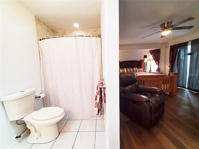 3456 Highlands Rd, Punta Gorda, FL 33983 - full bath with ceiling fan, a shower with shower curtain, and wood finished floors