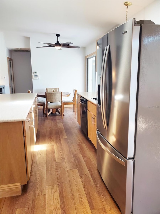 3456 Highlands Rd, Punta Gorda, FL 33983 - kitchen featuring stainless steel refrigerator with ice dispenser, black dishwasher, light wood finished floors, ceiling fan, and light countertops