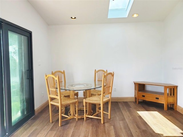 3456 Highlands Rd, Punta Gorda, FL 33983 - dining space with a skylight, wood finished floors, plenty of natural light, and recessed lighting