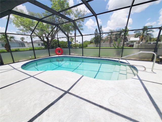 3456 Highlands Rd, Punta Gorda, FL 33983 - swimming pool with a patio area, glass enclosure, and a residential view