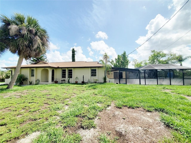 3456 Highlands Rd, Punta Gorda, FL 33983 - rear view of house with a yard, stucco siding, and a lanai