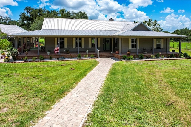 2788 SW County Road 769, Arcadia, FL 34266 - farmhouse inspired home featuring covered porch, a metal roof, and a front yard