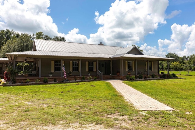2788 SW County Road 769, Arcadia, FL 34266 - rear view of property featuring a porch, a metal roof, a yard, and a chimney