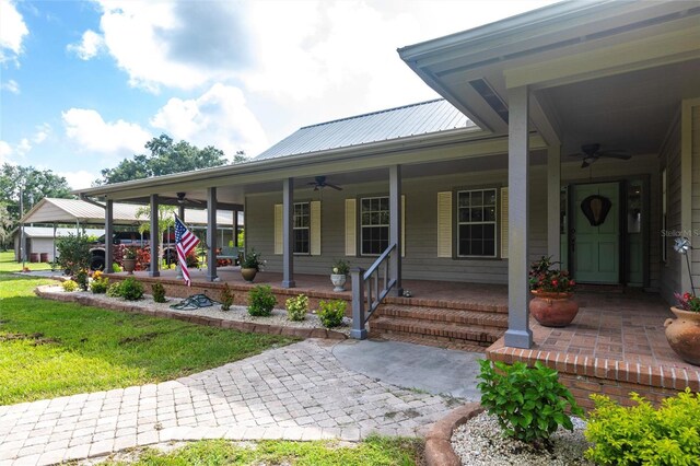 2788 SW County Road 769, Arcadia, FL 34266 - porch featuring a ceiling fan and a yard