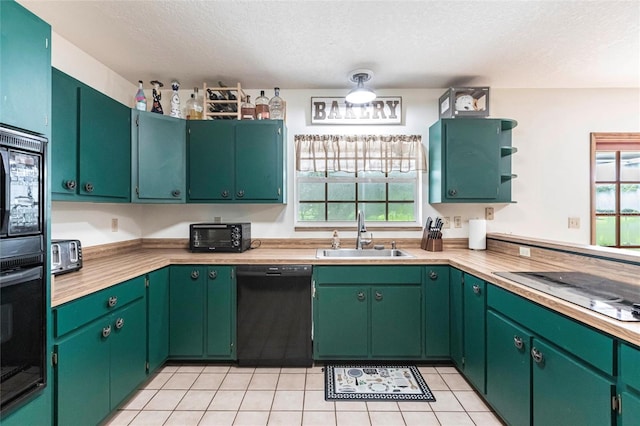 2788 SW County Road 769, Arcadia, FL 34266 - kitchen featuring black appliances, a textured ceiling, light tile patterned floors, open shelves, and light countertops