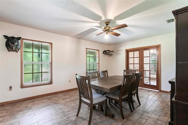 2788 SW County Road 769, Arcadia, FL 34266 - dining space with french doors, a ceiling fan, wood finished floors, and a textured ceiling
