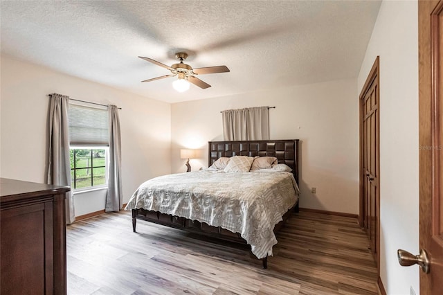 2788 SW County Road 769, Arcadia, FL 34266 - bedroom featuring light wood-type flooring, a textured ceiling, and ceiling fan
