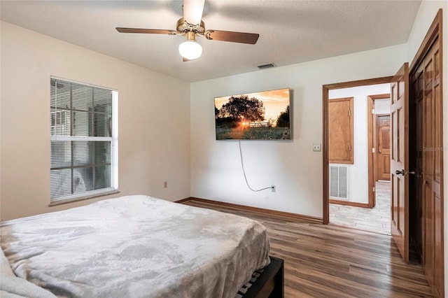2788 SW County Road 769, Arcadia, FL 34266 - bedroom with wood finished floors and a ceiling fan