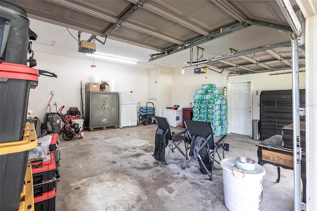 2788 SW County Road 769, Arcadia, FL 34266 - garage with a garage door opener and freestanding refrigerator