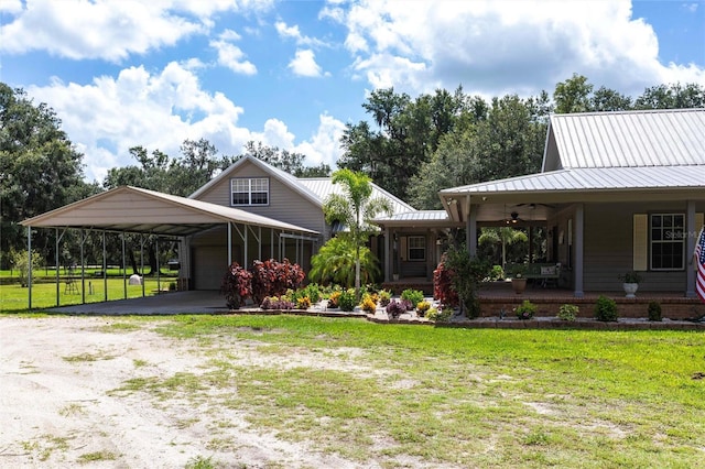 2788 SW County Road 769, Arcadia, FL 34266 - farmhouse-style home featuring a front yard, a porch, a ceiling fan, dirt driveway, and a metal roof