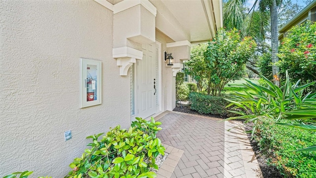 786 Regency Reserve Cir Unit 1404, Naples, FL 34119 - doorway to property featuring stucco siding