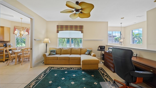 786 Regency Reserve Cir Unit 1404, Naples, FL 34119 - living room featuring light tile patterned floors, an office area, ceiling fan, and a chandelier