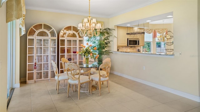 786 Regency Reserve Cir Unit 1404, Naples, FL 34119 - dining space with a chandelier, ornamental molding, and light tile patterned floors