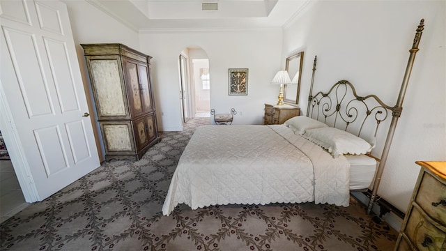 786 Regency Reserve Cir Unit 1404, Naples, FL 34119 - carpeted bedroom featuring arched walkways, crown molding, and a tray ceiling