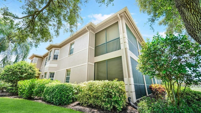 786 Regency Reserve Cir Unit 1404, Naples, FL 34119 - view of property exterior with stucco siding