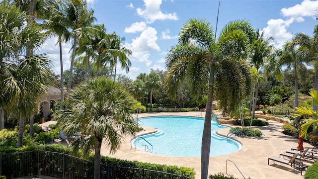 786 Regency Reserve Cir Unit 1404, Naples, FL 34119 - community pool with a patio
