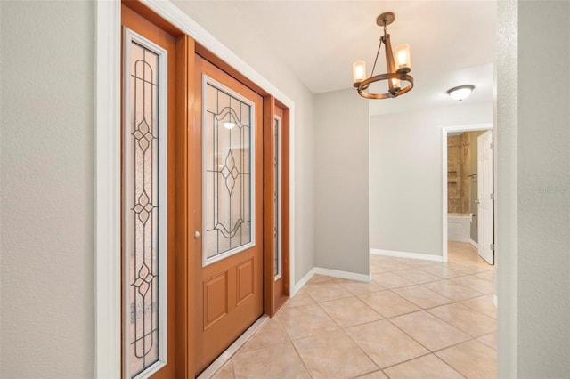 10810 Wheeler Pl, Punta Gorda, FL 33950 - entrance foyer with a chandelier and light tile patterned floors
