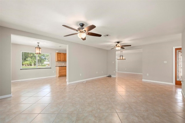 10810 Wheeler Pl, Punta Gorda, FL 33950 - unfurnished living room featuring ceiling fan and light tile patterned flooring