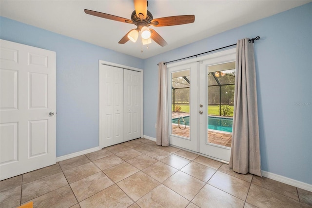10810 Wheeler Pl, Punta Gorda, FL 33950 - unfurnished bedroom with french doors, access to exterior, a closet, ceiling fan, and light tile patterned floors