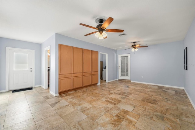 10810 Wheeler Pl, Punta Gorda, FL 33950 - unfurnished living room with a ceiling fan and light stone finish flooring