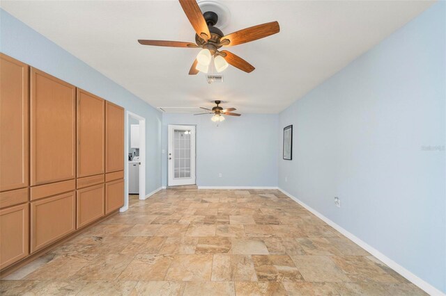 10810 Wheeler Pl, Punta Gorda, FL 33950 - spare room featuring ceiling fan and stone finish floors