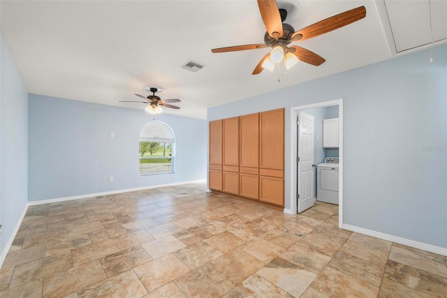 10810 Wheeler Pl, Punta Gorda, FL 33950 - unfurnished bedroom featuring attic access, washer / dryer, stone finish flooring, and a ceiling fan