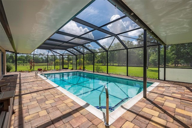 10810 Wheeler Pl, Punta Gorda, FL 33950 - swimming pool with a patio, glass enclosure, and view of wooded area