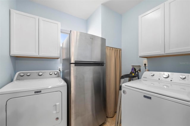 10810 Wheeler Pl, Punta Gorda, FL 33950 - laundry area with washing machine and clothes dryer and cabinet space
