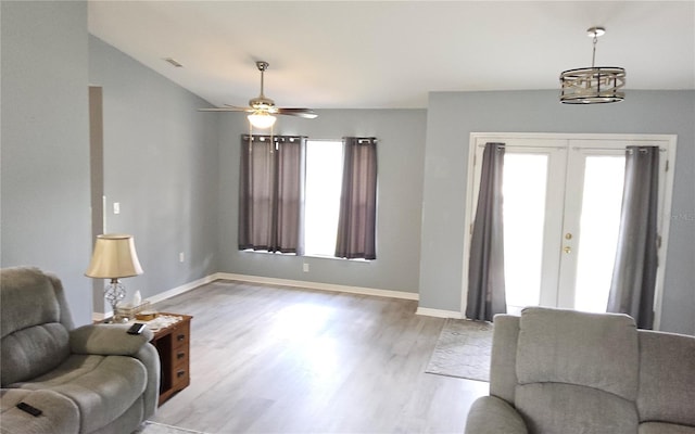 6341 Opa Locka Ln, North Port, FL 34291 - living area with light wood-style floors, french doors, ceiling fan, and lofted ceiling