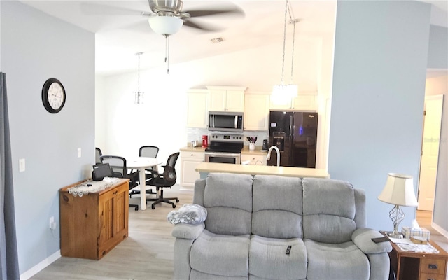 6341 Opa Locka Ln, North Port, FL 34291 - living room with ceiling fan, light wood-type flooring, and lofted ceiling