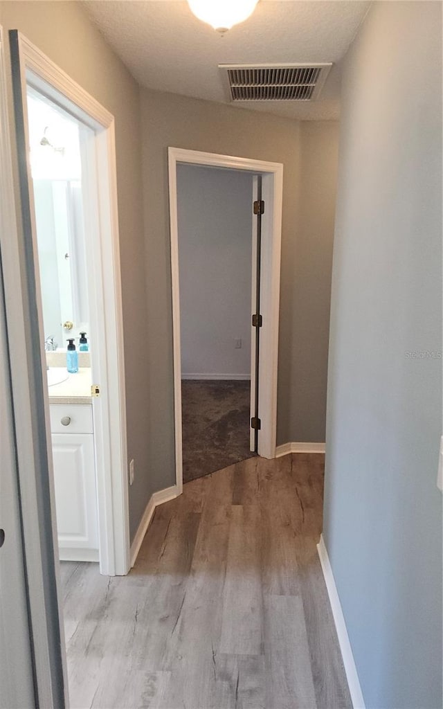 6341 Opa Locka Ln, North Port, FL 34291 - hallway featuring light wood-style floors and baseboards