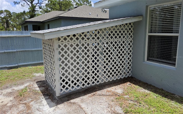 6341 Opa Locka Ln, North Port, FL 34291 - exterior view of roof with shingles and stucco siding