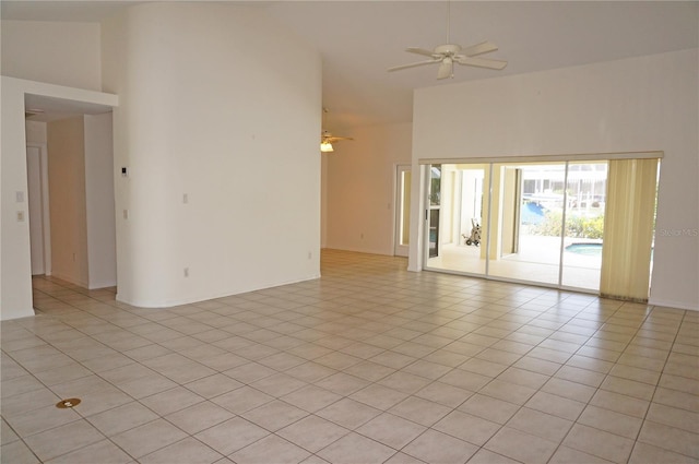 1128 Rum Cay Ct, Punta Gorda, FL 33950 - unfurnished room with high vaulted ceiling, a ceiling fan, and light tile patterned floors