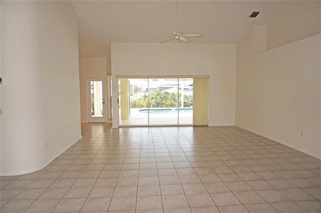 1128 Rum Cay Ct, Punta Gorda, FL 33950 - spare room featuring high vaulted ceiling, a ceiling fan, and light tile patterned floors