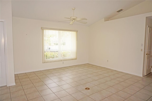 1128 Rum Cay Ct, Punta Gorda, FL 33950 - empty room with vaulted ceiling, a ceiling fan, and light tile patterned floors
