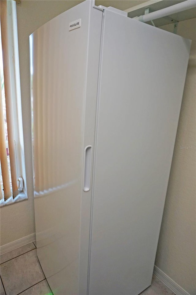 1128 Rum Cay Ct, Punta Gorda, FL 33950 - detailed view of freestanding refrigerator and baseboards
