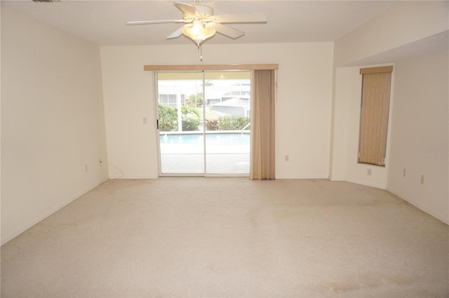 1128 Rum Cay Ct, Punta Gorda, FL 33950 - empty room featuring light carpet and a ceiling fan