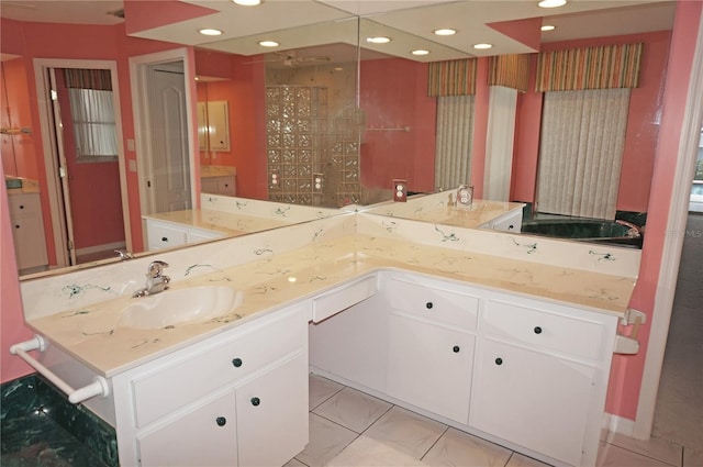 1128 Rum Cay Ct, Punta Gorda, FL 33950 - bathroom with double vanity and recessed lighting