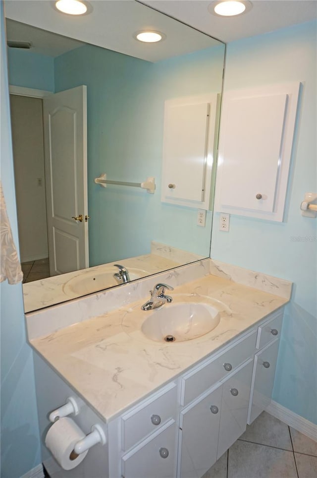 1128 Rum Cay Ct, Punta Gorda, FL 33950 - bathroom with vanity and tile patterned flooring