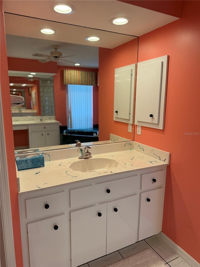 1128 Rum Cay Ct, Punta Gorda, FL 33950 - bathroom featuring a ceiling fan, vanity, and recessed lighting