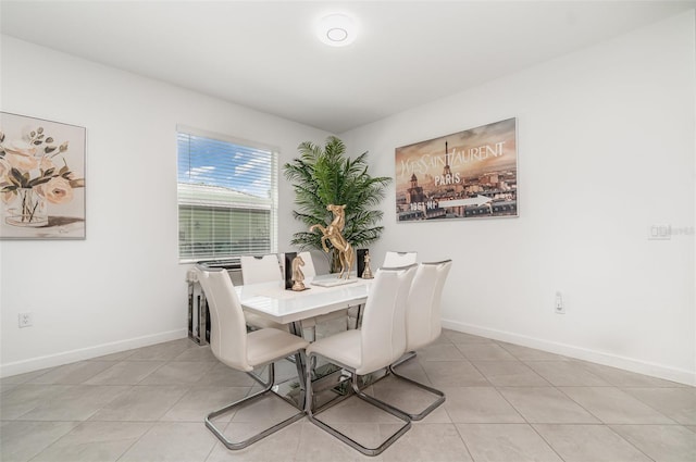 24348 Nicobar Ln, Punta Gorda, FL 33955 - dining area featuring light tile patterned flooring and baseboards