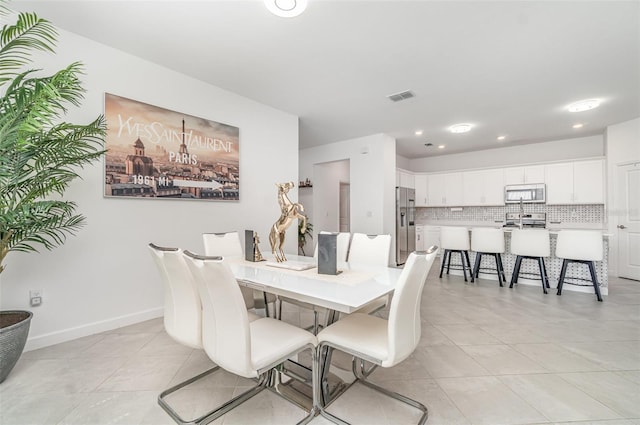 24348 Nicobar Ln, Punta Gorda, FL 33955 - dining room featuring light tile patterned floors and recessed lighting