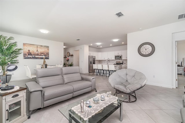 24348 Nicobar Ln, Punta Gorda, FL 33955 - living area with light tile patterned floors and recessed lighting